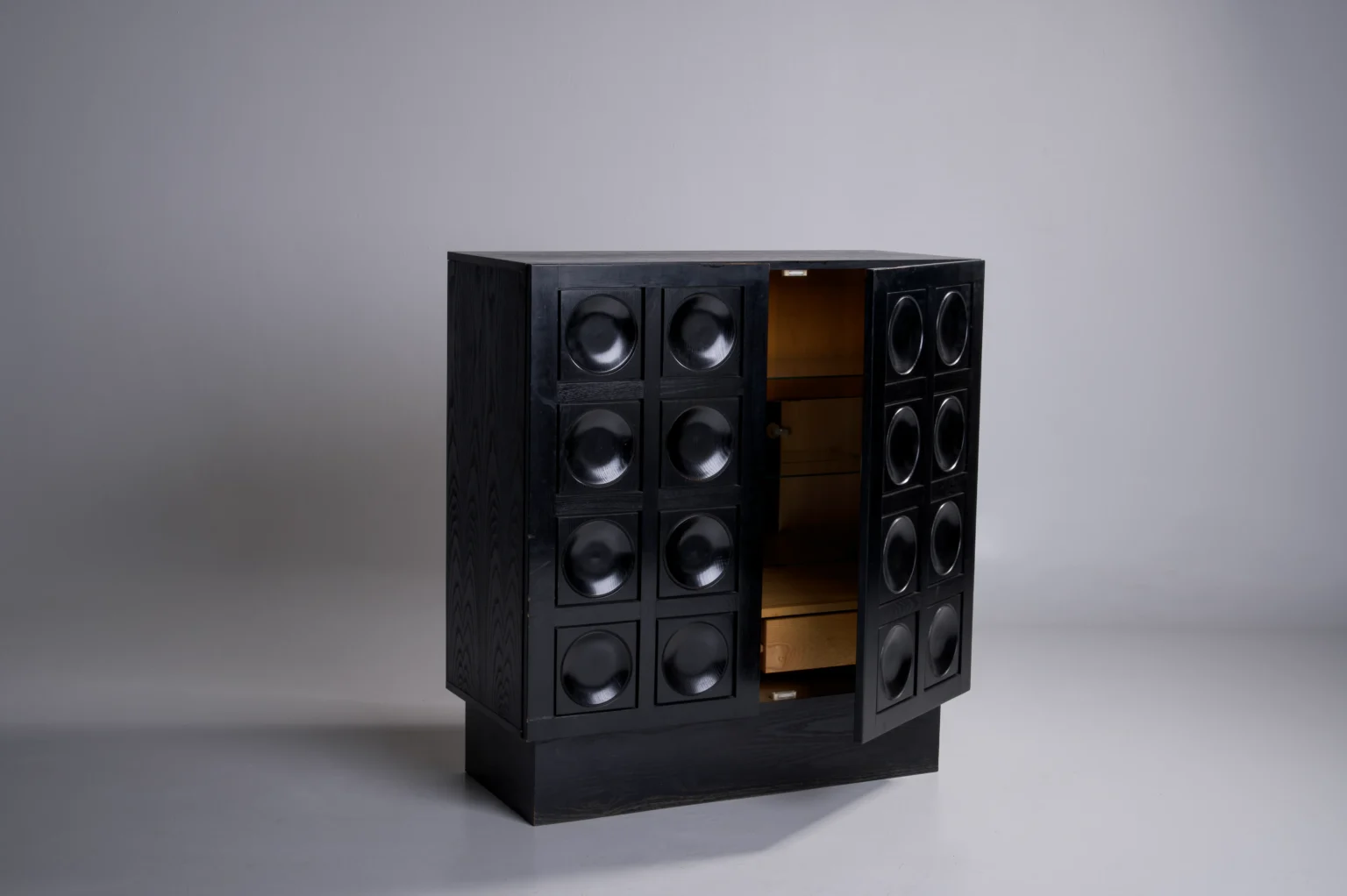 Studio Menzel - Black Brutalist Bar Cabinet Circles Open Doors